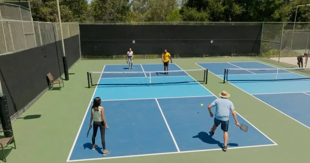 Players Playing Pickle Ball in the Court